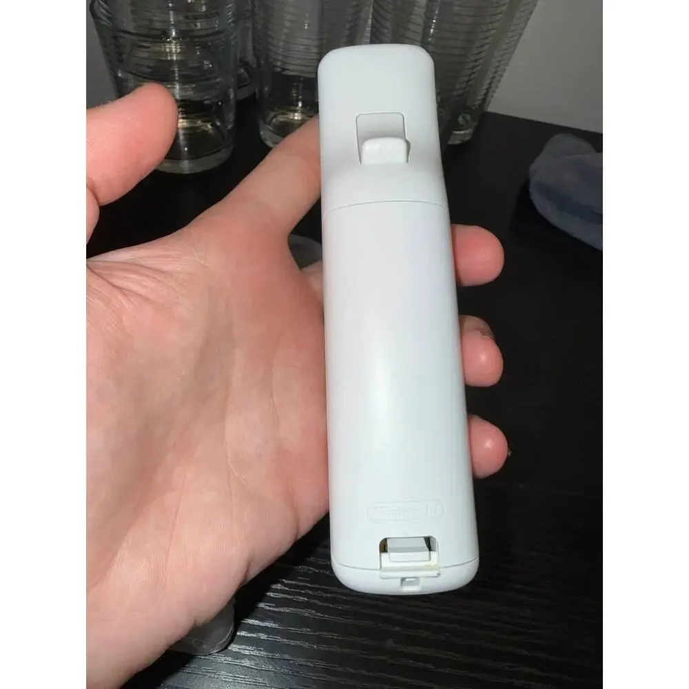 Nintendo Wii Remote with Nunchuk and Wii MotionPlus Adapter